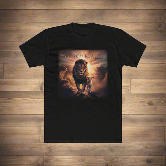A black t-shirt is displayed on a wooden floor, featuring a vivid graphic of a majestic lion and a lamb standing together under dramatic, glowing clouds. Above the image, the text reads "ARE YOU READY?" with "Revelation 5:5" written underneath. The design evokes themes of strength, peace, and biblical prophecy.